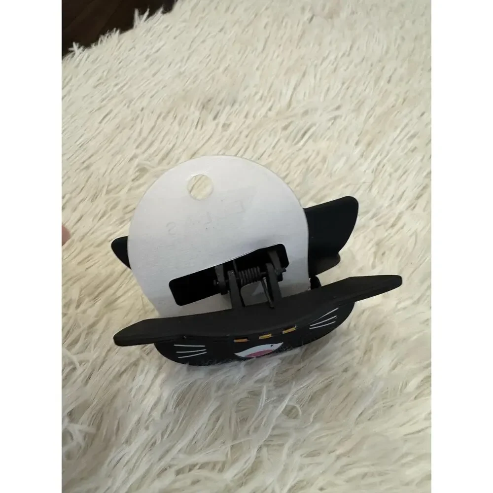 Large Black cat hair clip claw with white whiskers, red nose, and pink mouth